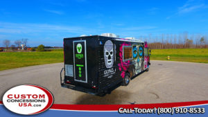 black food truck with brightly colored day of the dead designs