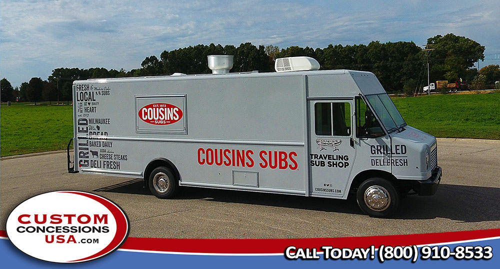 white food truck that says "Cousins Subs" in red