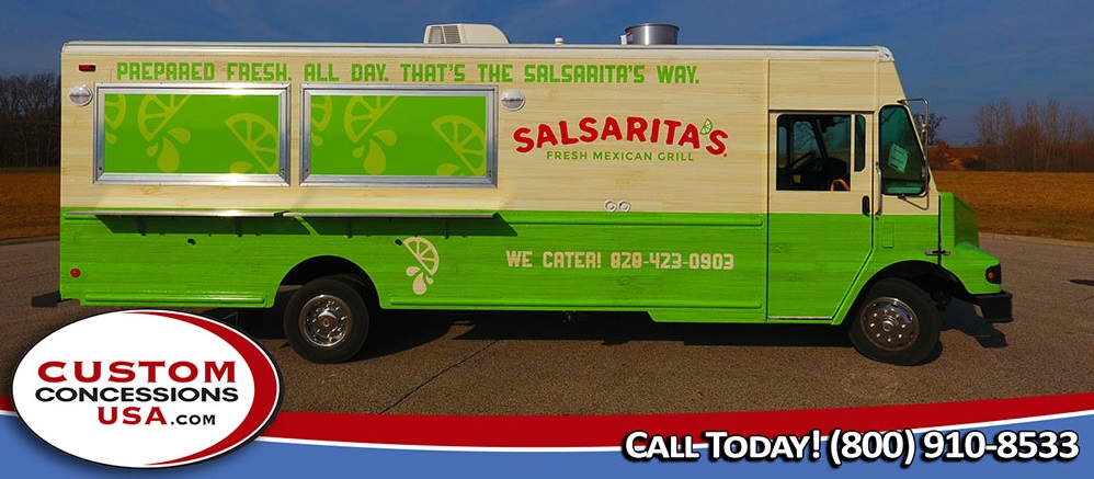 green and yellow food truck with two service windows