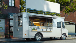 realistic 3d rendering of a white food truck parked on a city street with brick buildings and trees in the background