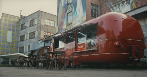 red food truck parked on a city street